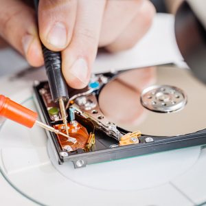 expert repairing a hard drive
